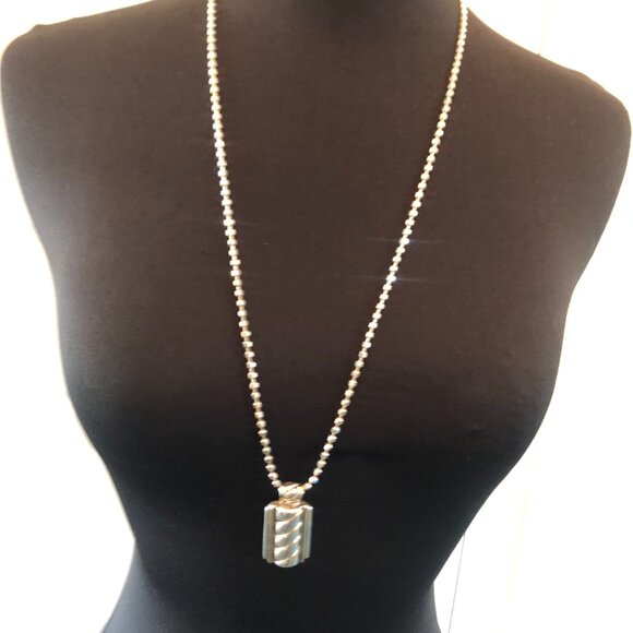 Hand crafted Jewelry - Silver colored oblong pendant 2 in by 1 in - light gold trim